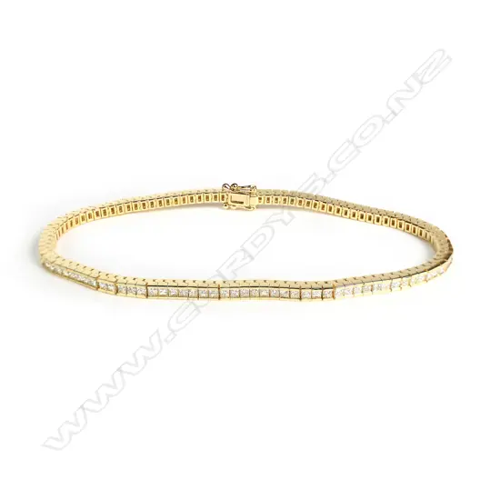 An 18ct yellow gold and diamond tennis bracelet