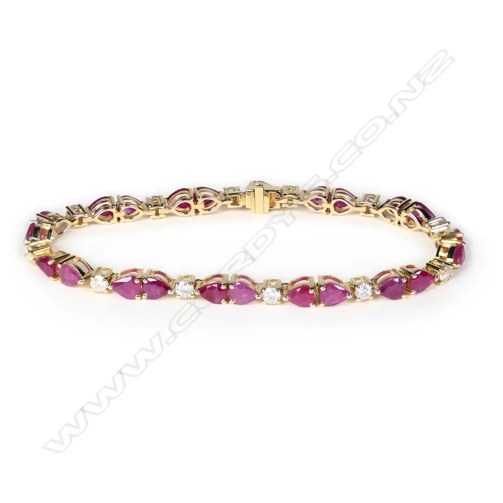 A 14ct gold ruby and diamond line bracelet Image 1++