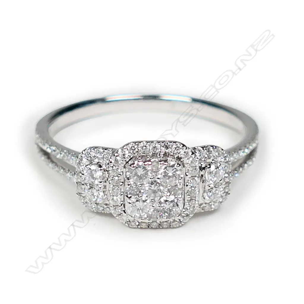 An 18ct white gold and diamond cluster ring Image 1++