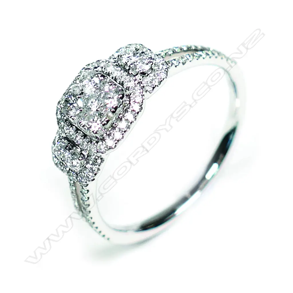 An 18ct white gold and diamond cluster ring Image 1++