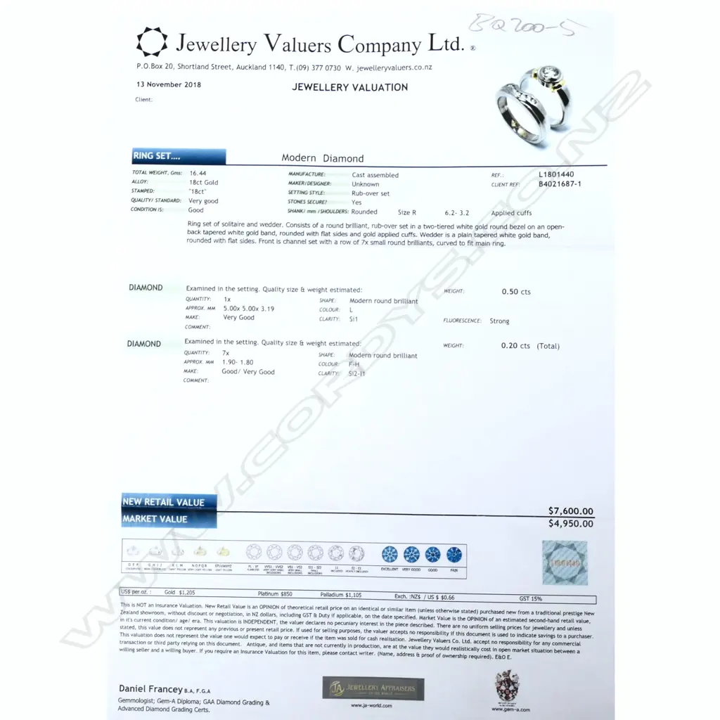 A pair of modern 18ct white gold and diamond solitaire and wedding rings Image 1++