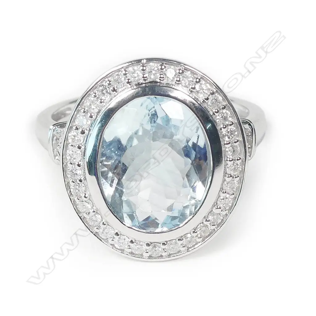 A 14ct white gold aquamarine and diamond ring Image 1++