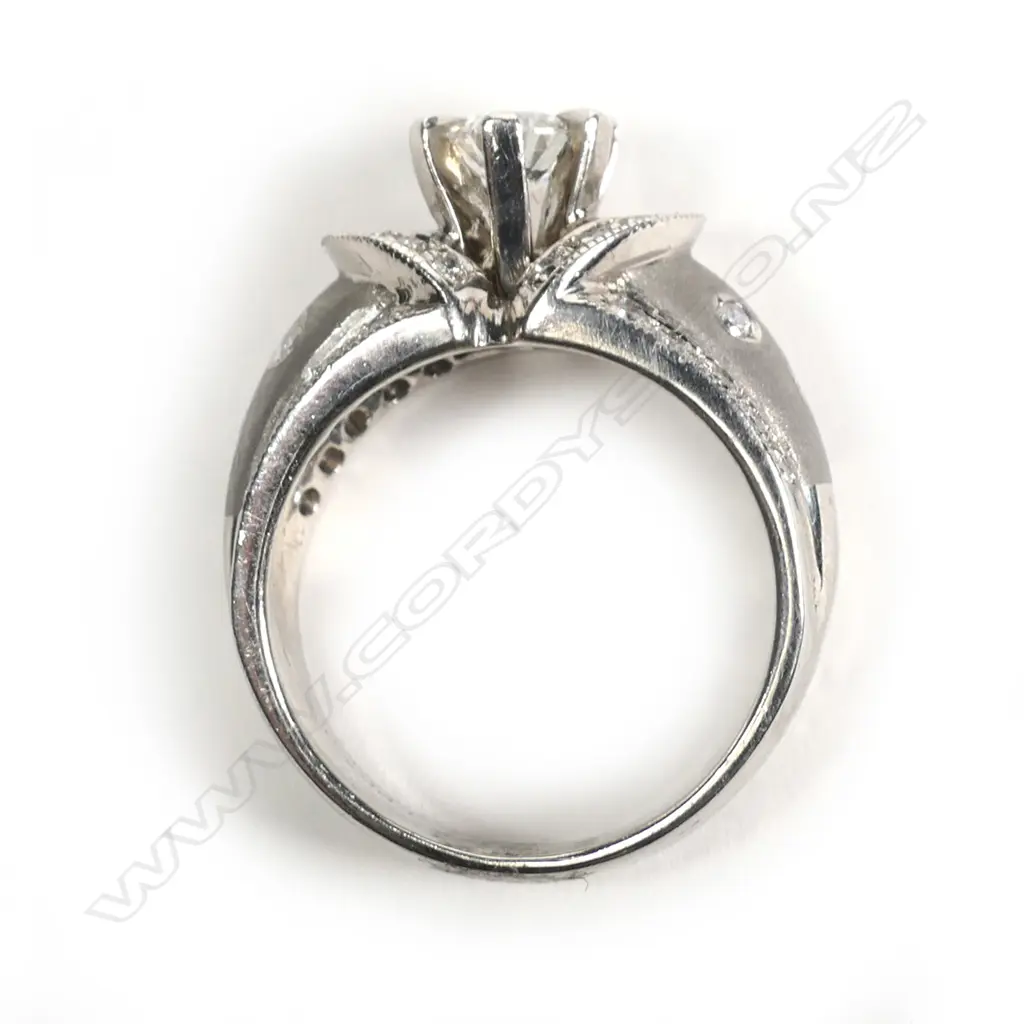 A stylish platinum and diamond dress ring Image 1++