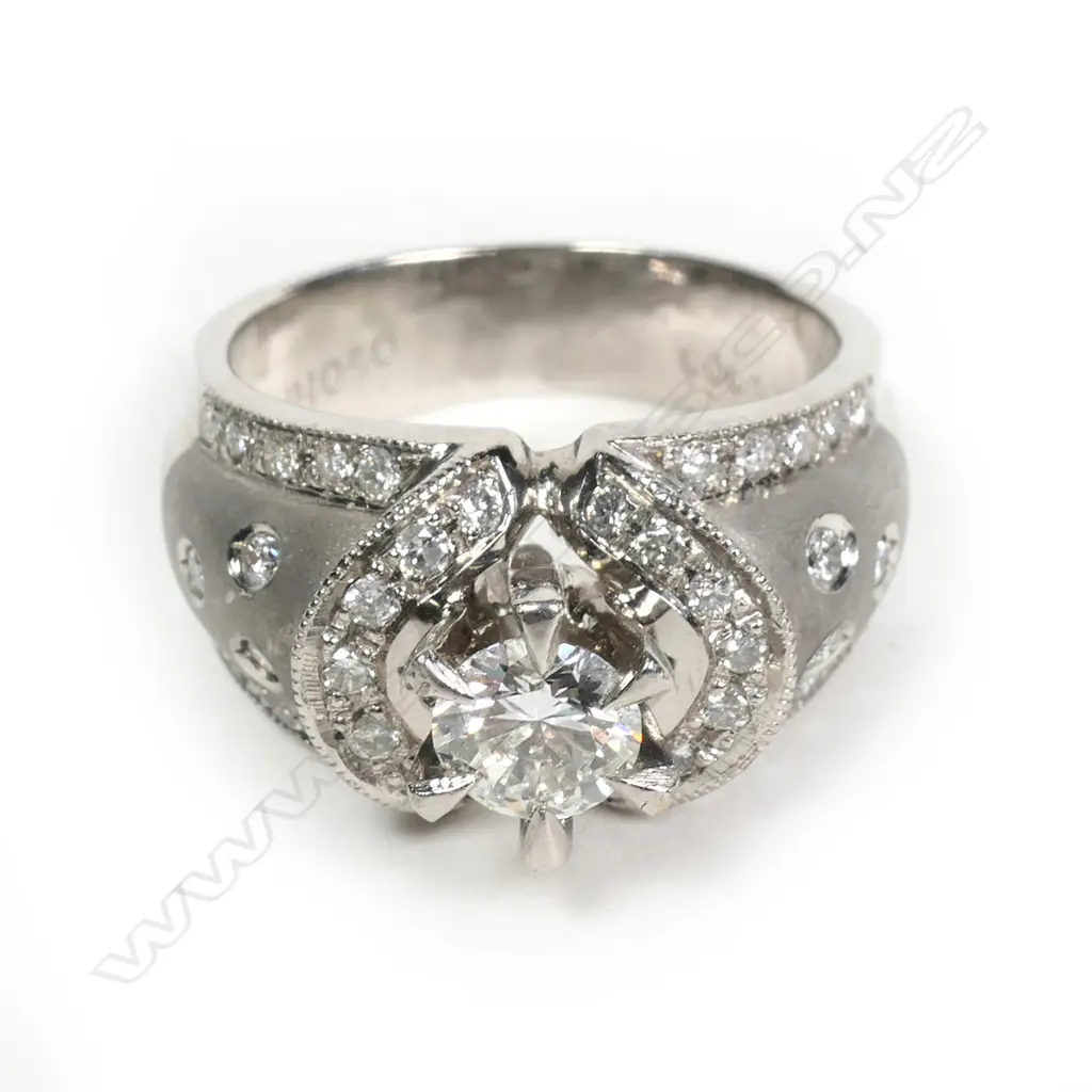 A stylish platinum and diamond dress ring Image 1++