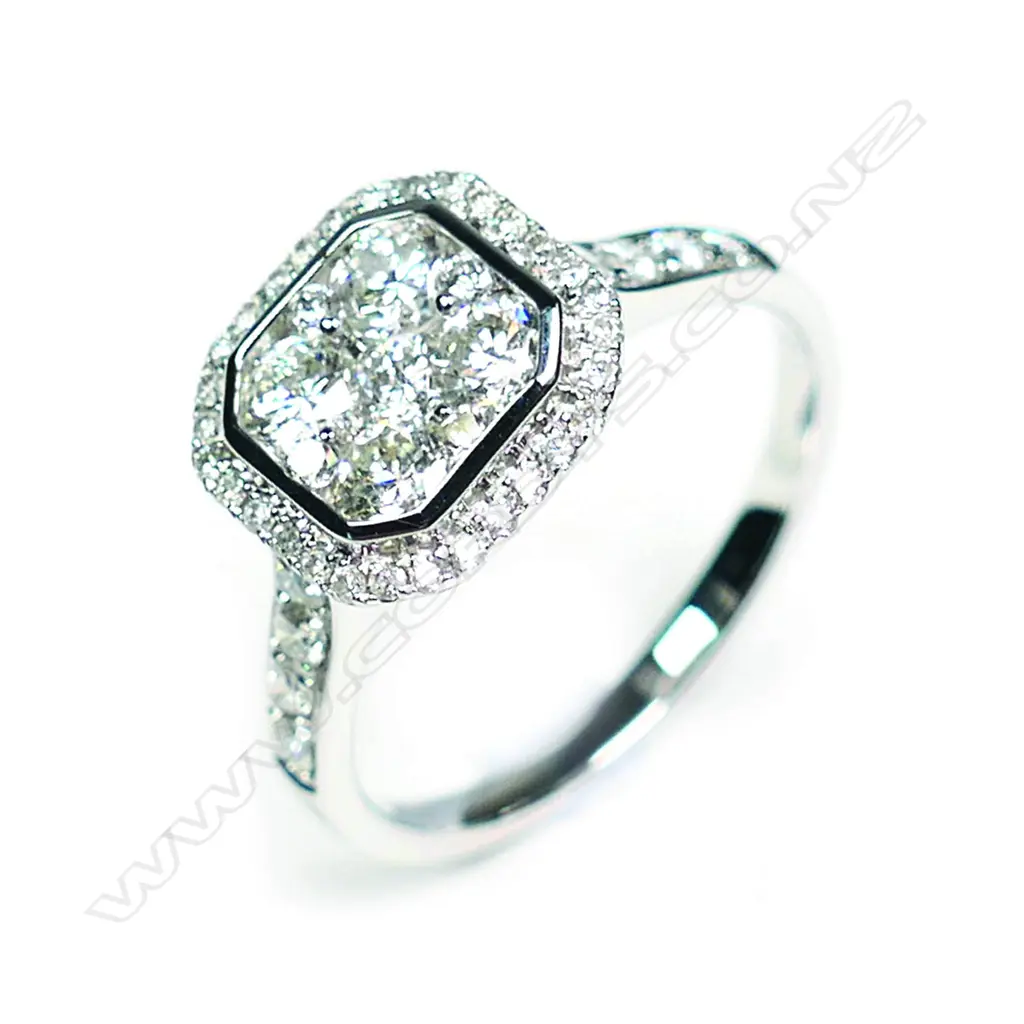 A modern 18ct white gold and diamond cluster ring Image 1++