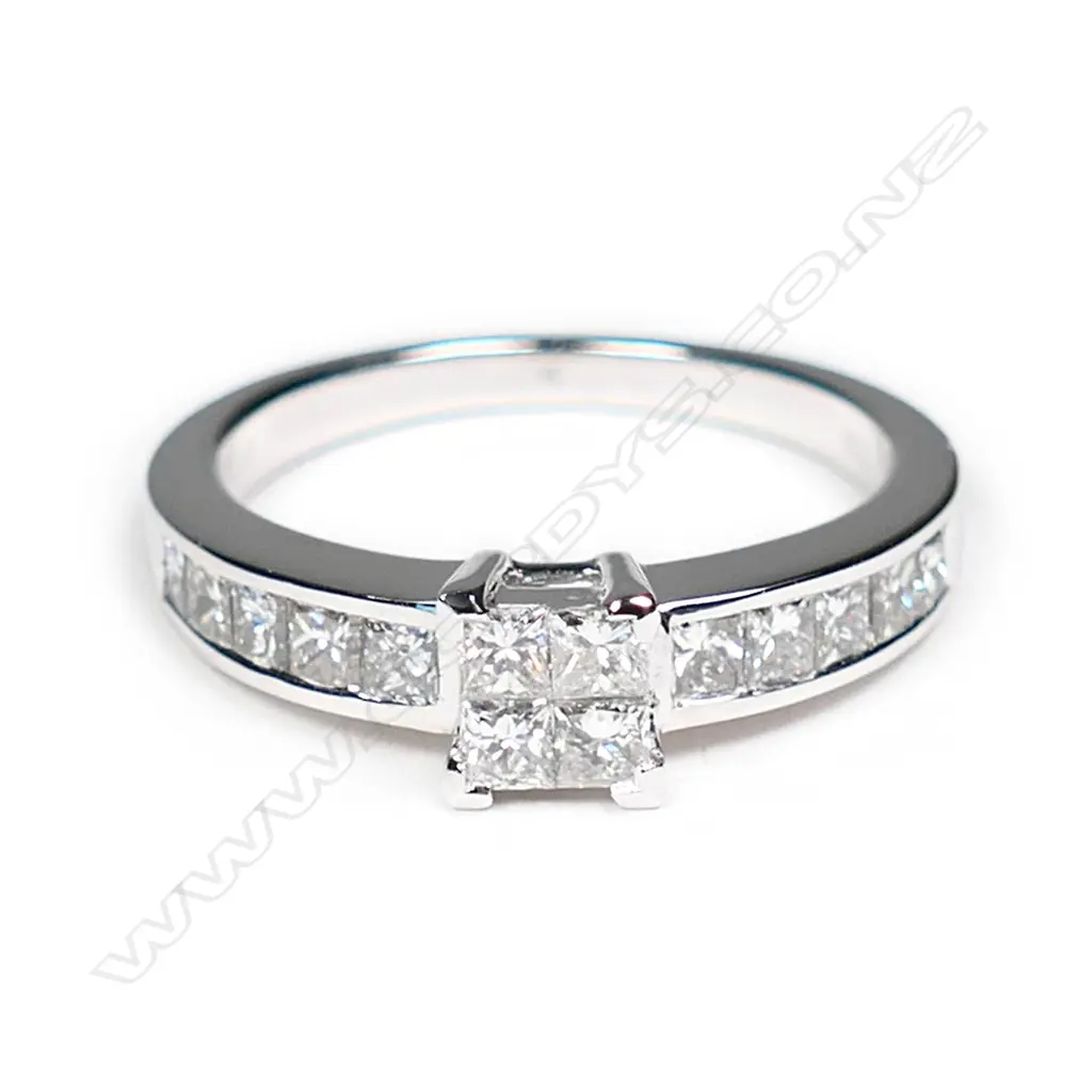 An 18ct white gold and diamond ring the raised square top with four princess cut diamonds Image 1++