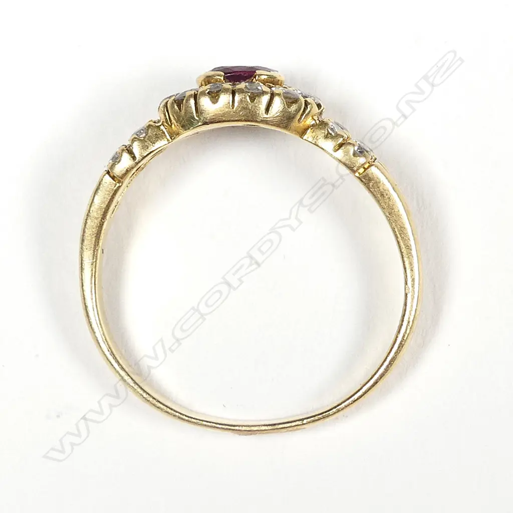 An 18ct yellow gold ruby and diamond cluster ring Image 1++