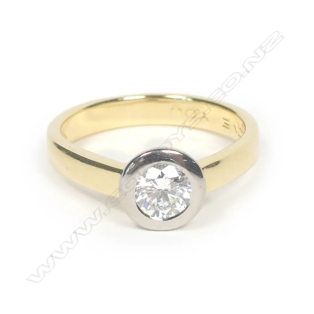 An 18ct gold and diamond solitaire ring Image 1++