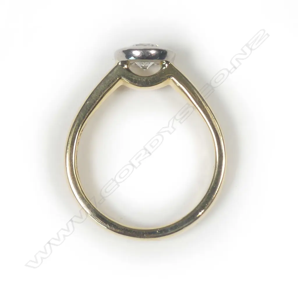 An 18ct gold and diamond solitaire ring Image 1++