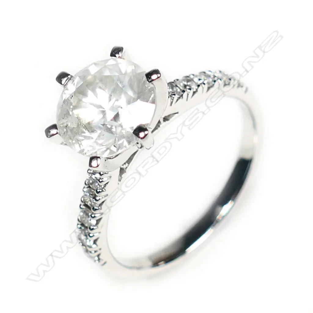 A 14ct white gold and diamond solitaire ring Image 1++