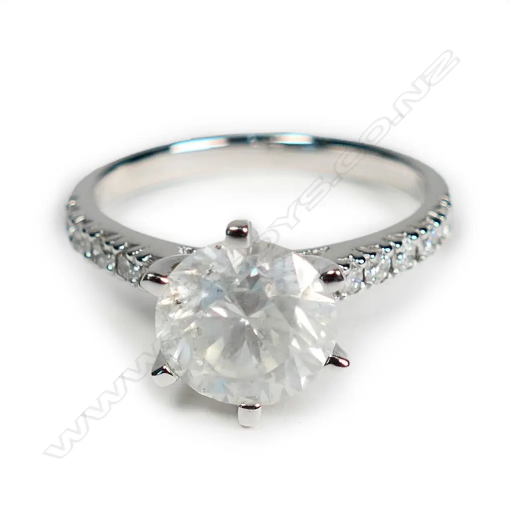 A 14ct white gold and diamond solitaire ring Image 1++