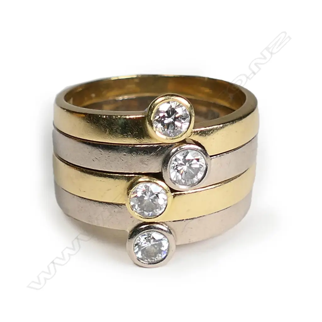 An 18ct gold and diamond four ring stacking set Image 1++