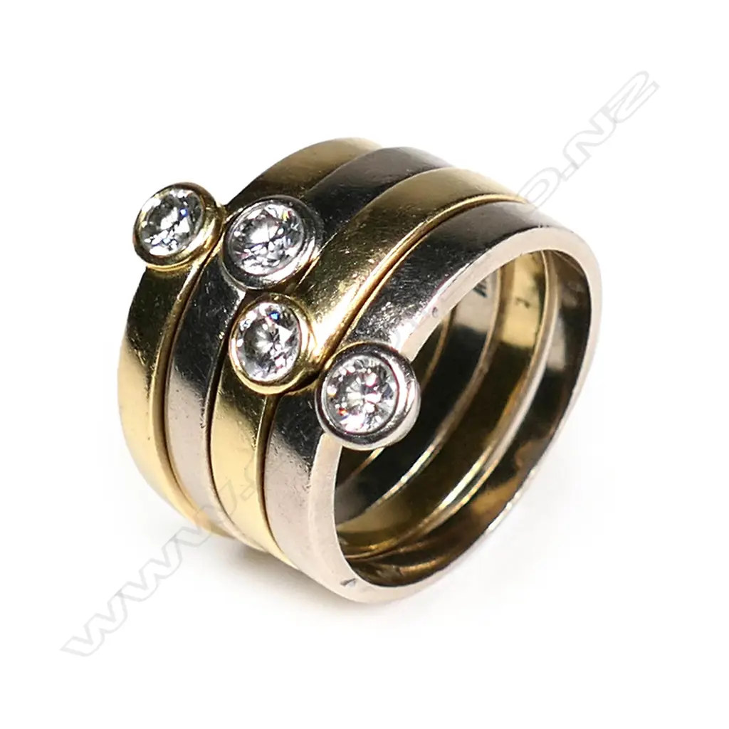An 18ct gold and diamond four ring stacking set Image 1++