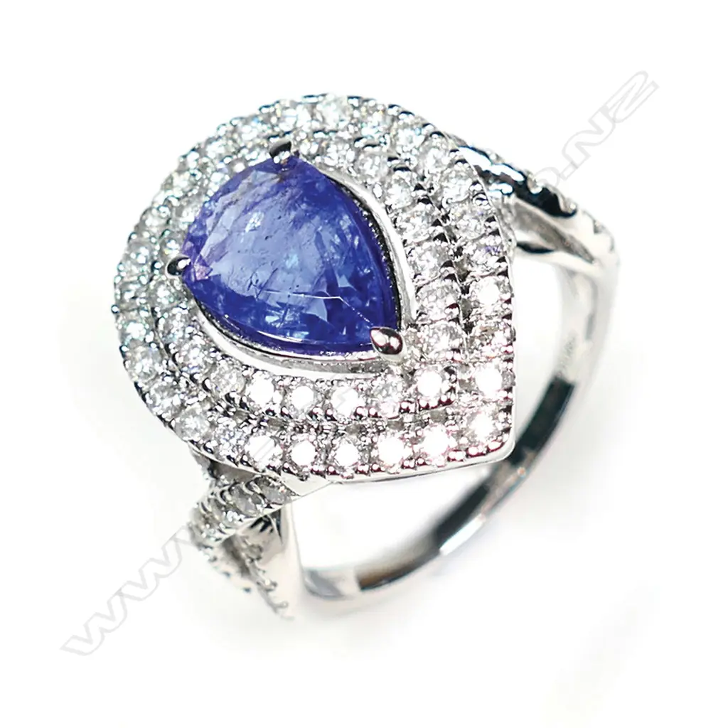 A 14ct white gold and tanzanite and diamond double halo ring Image 1++