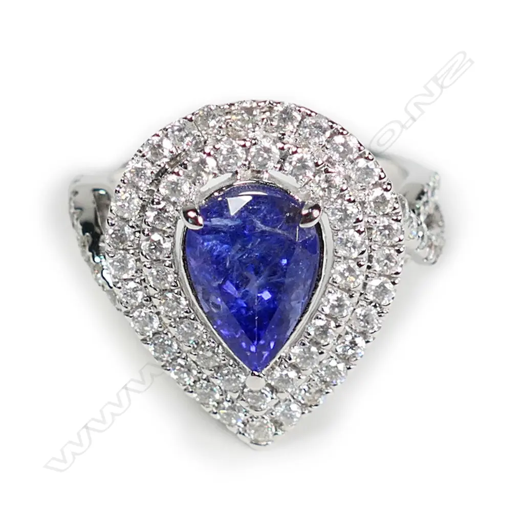A 14ct white gold and tanzanite and diamond double halo ring Image 1++