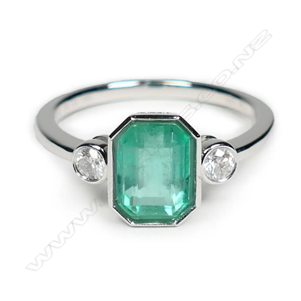 A 14ct white gold Colombian emerald and diamond ring Image 1++