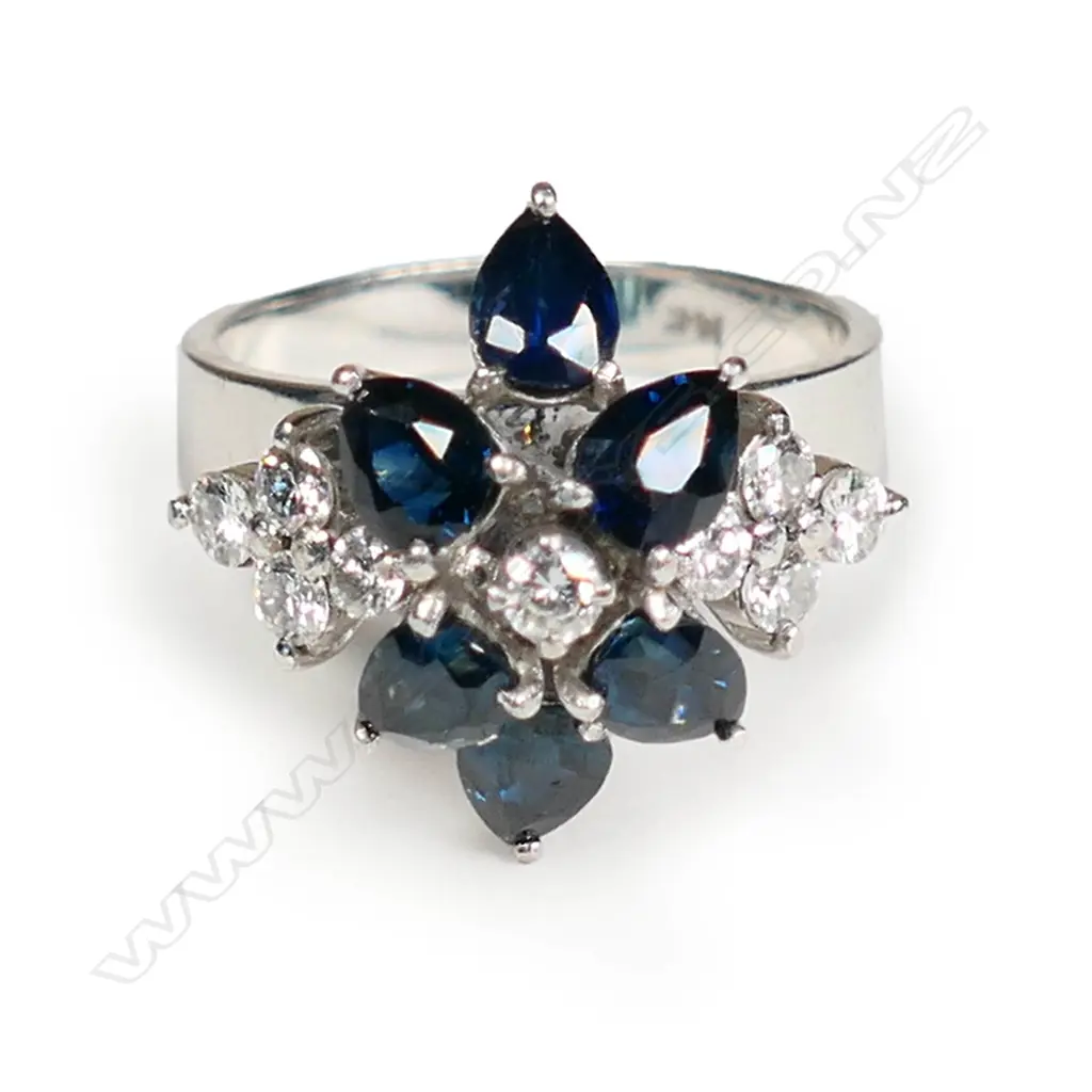 A 14ct white gold sapphire and diamond ring Image 1++