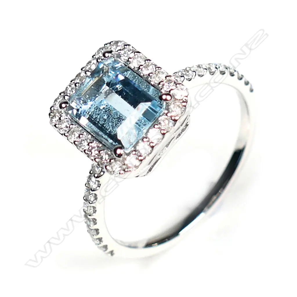 A 14ct white gold aquamarine and diamond halo ring Image 1++