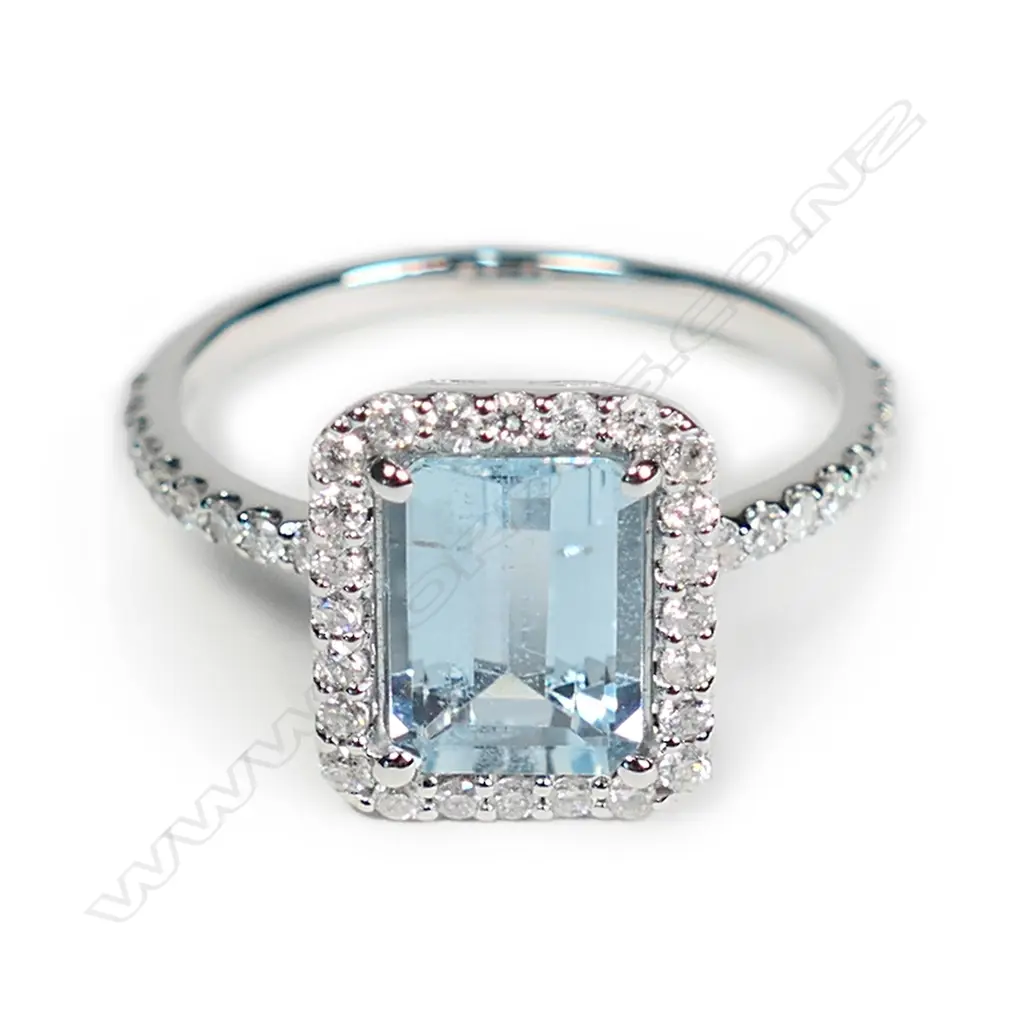 A 14ct white gold aquamarine and diamond halo ring Image 1++
