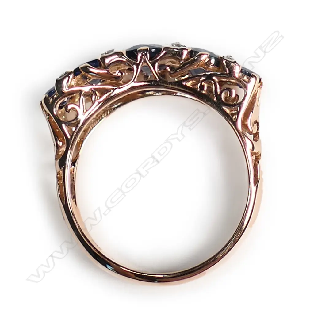 A 14ct rose gold sapphire and diamond London Bridge style ring Image 1++