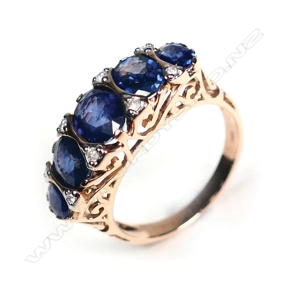 A 14ct rose gold sapphire and diamond London Bridge style ring Image 1++