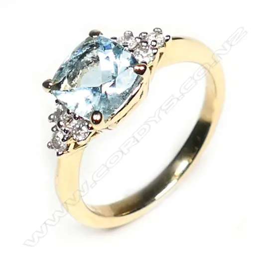 A 14ct yellow gold aquamarine and diamond ring