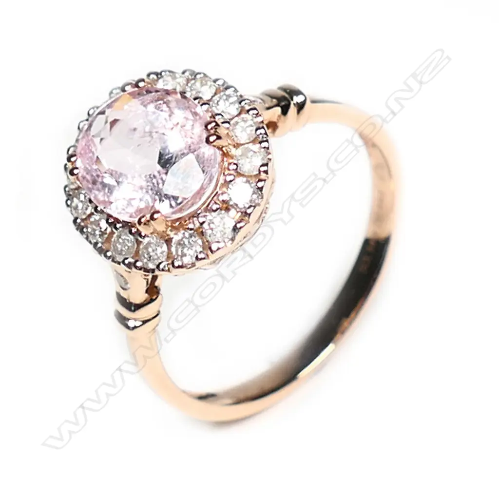 A 14ct rose gold morganite and diamond halo ring Image 1++
