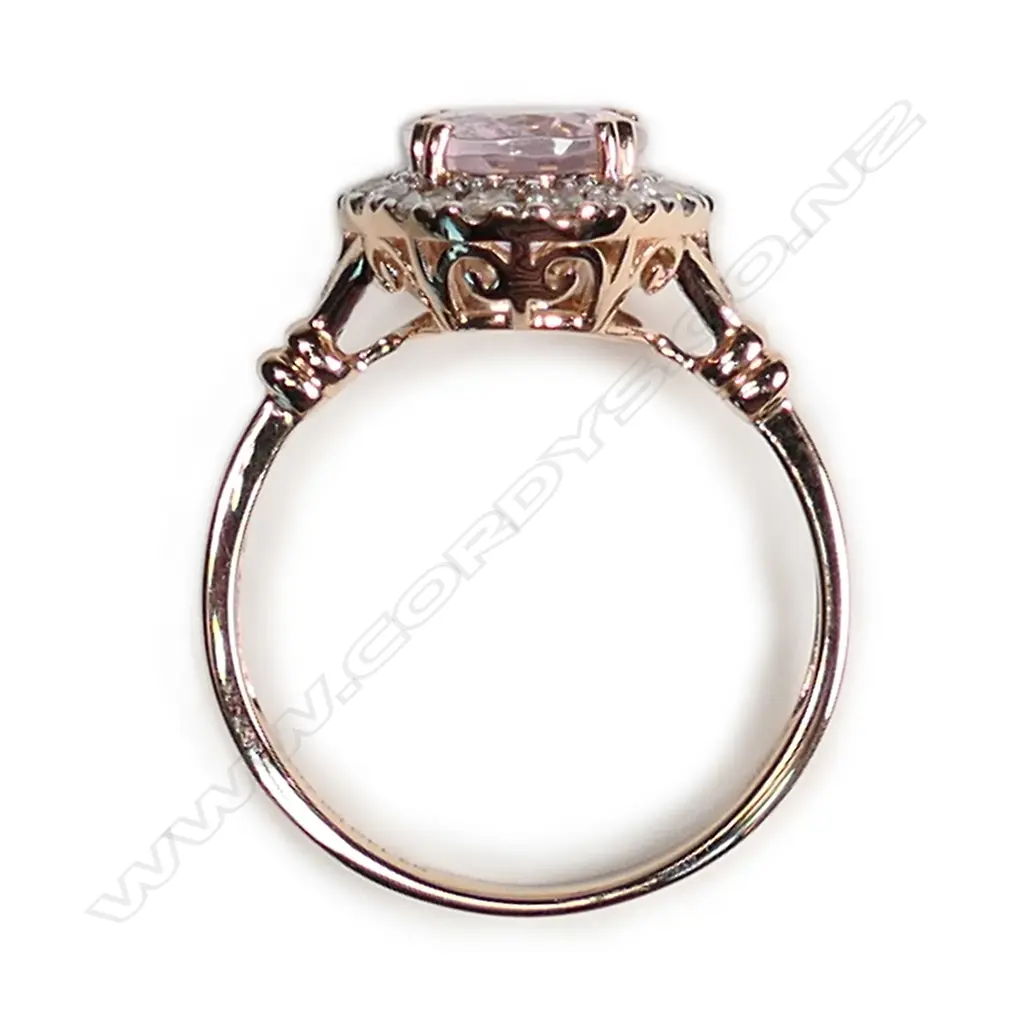 A 14ct rose gold morganite and diamond halo ring Image 1++