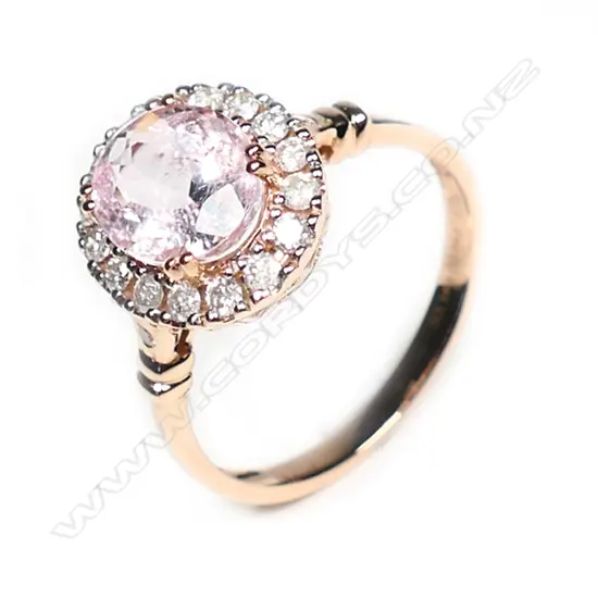 A 14ct rose gold morganite and diamond halo ring