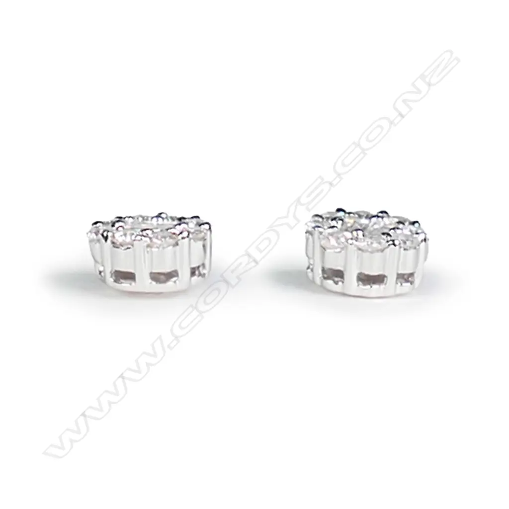 A pair of 18ct white gold and diamond cluster earrings Image 1++