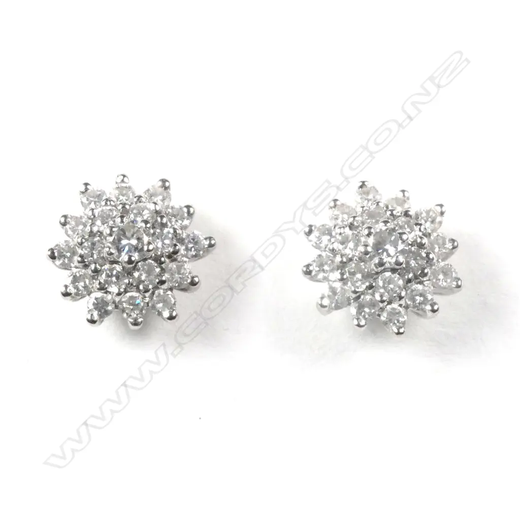 A pair of 18ct white gold and diamond cluster earrings Image 1++