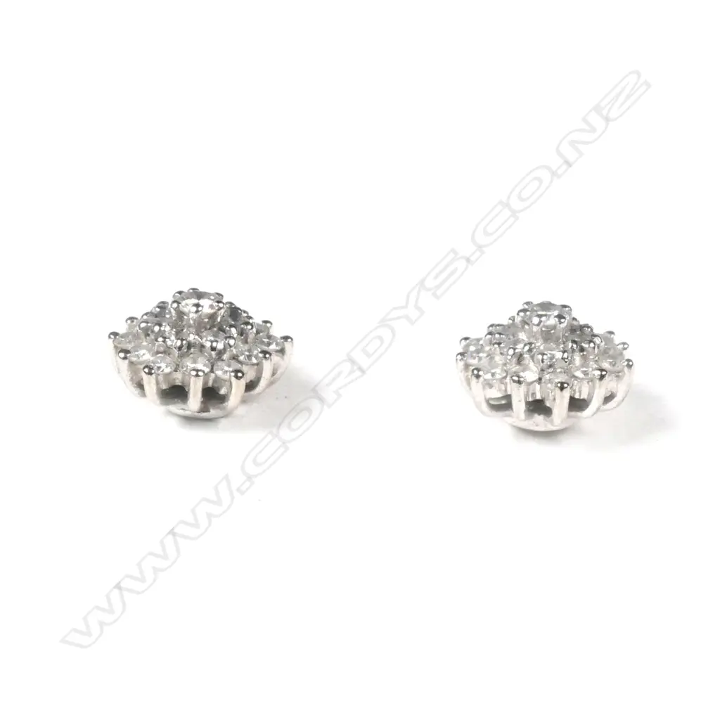 A pair of 18ct white gold and diamond cluster earrings Image 1++