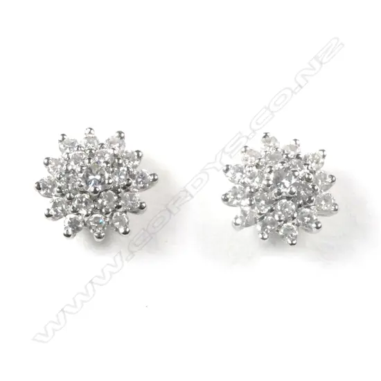 A pair of 18ct white gold and diamond cluster earrings