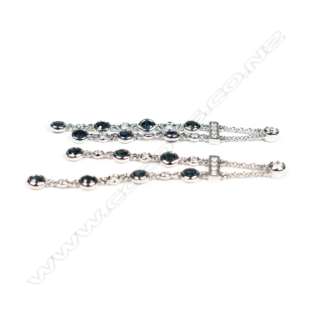 A pair of 14ct white gold diamond and sapphire drop chain earrings Image 1++