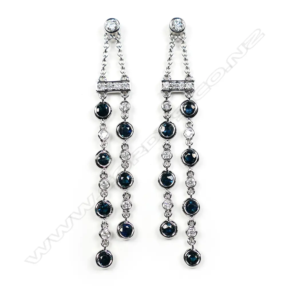 A pair of 14ct white gold diamond and sapphire drop chain earrings Image 1++