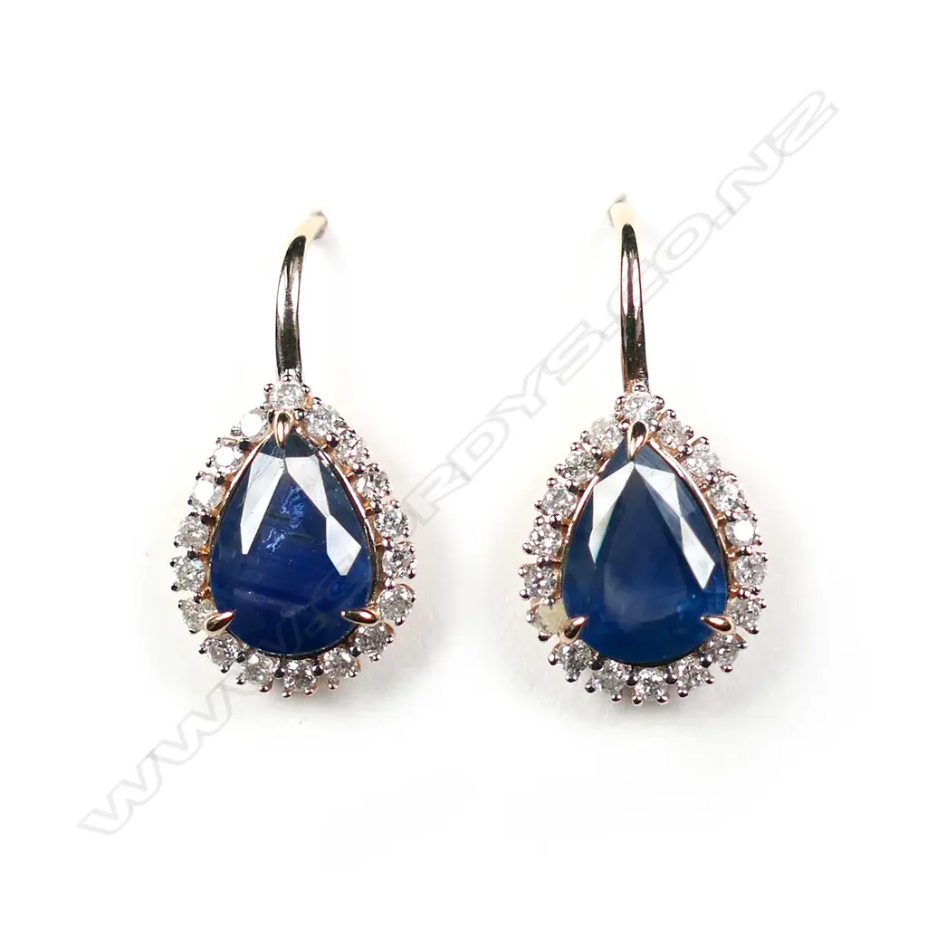 A pair of 14ct rose gold blue sapphire and diamond halo earrings Image 1++