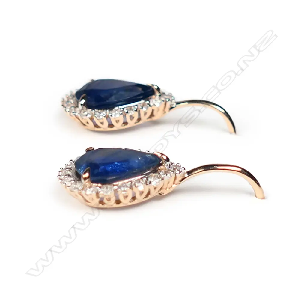 A pair of 14ct rose gold blue sapphire and diamond halo earrings Image 1++