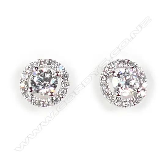A pair of 18ct white gold and diamond cluster earrings