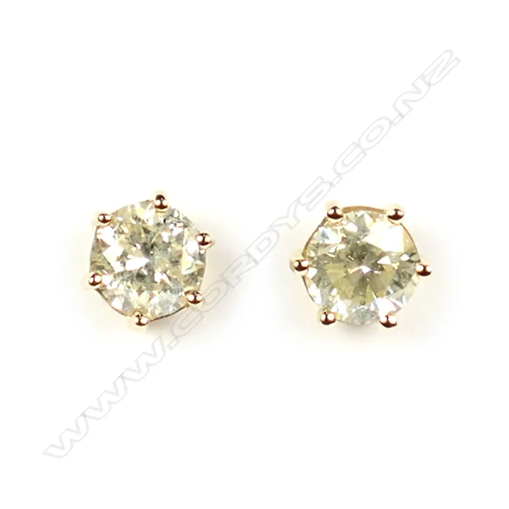 A pair of 14ct yellow gold and diamond stud earrings Image 1++