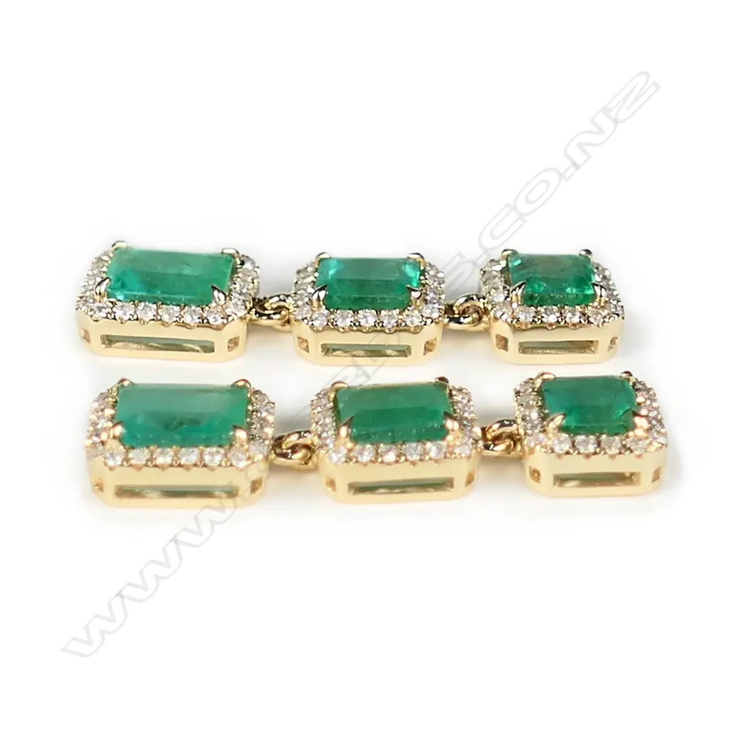 A pair of 14ct gold emerald and diamond triple drop halo earrings Image 1++