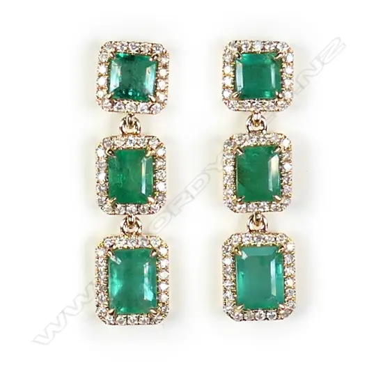 A pair of 14ct gold emerald and diamond triple drop halo earrings