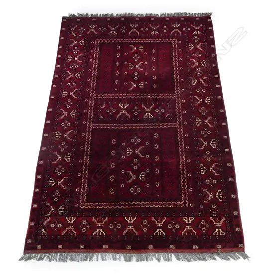 A hand knotted Afghan rug