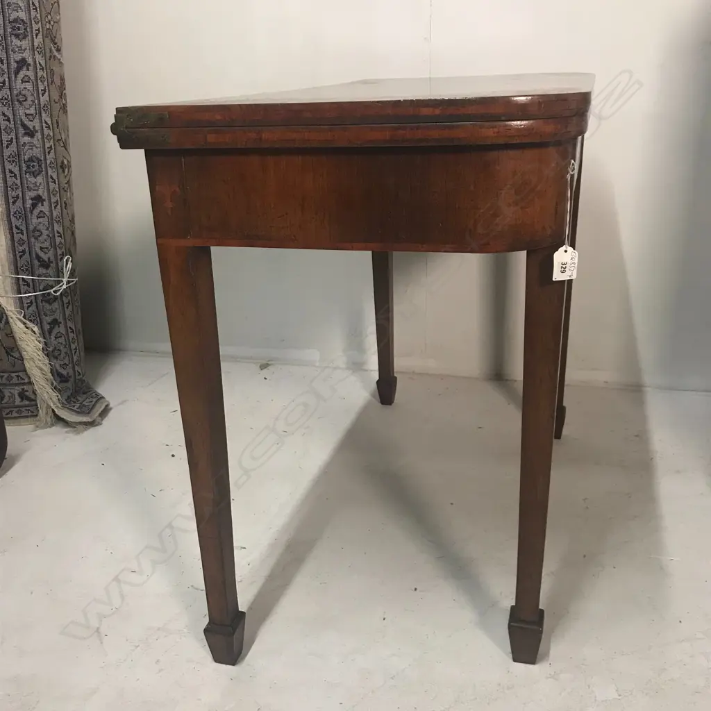 A George III mahogany fold-over top card table Image 1++