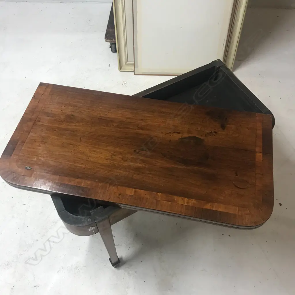 A George III mahogany fold-over top card table Image 1++