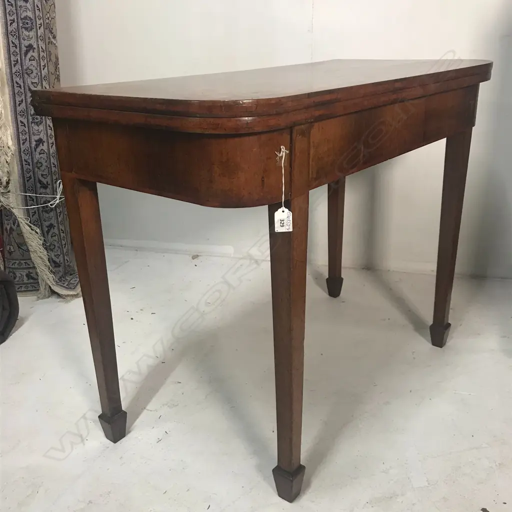 A George III mahogany fold-over top card table Image 1++