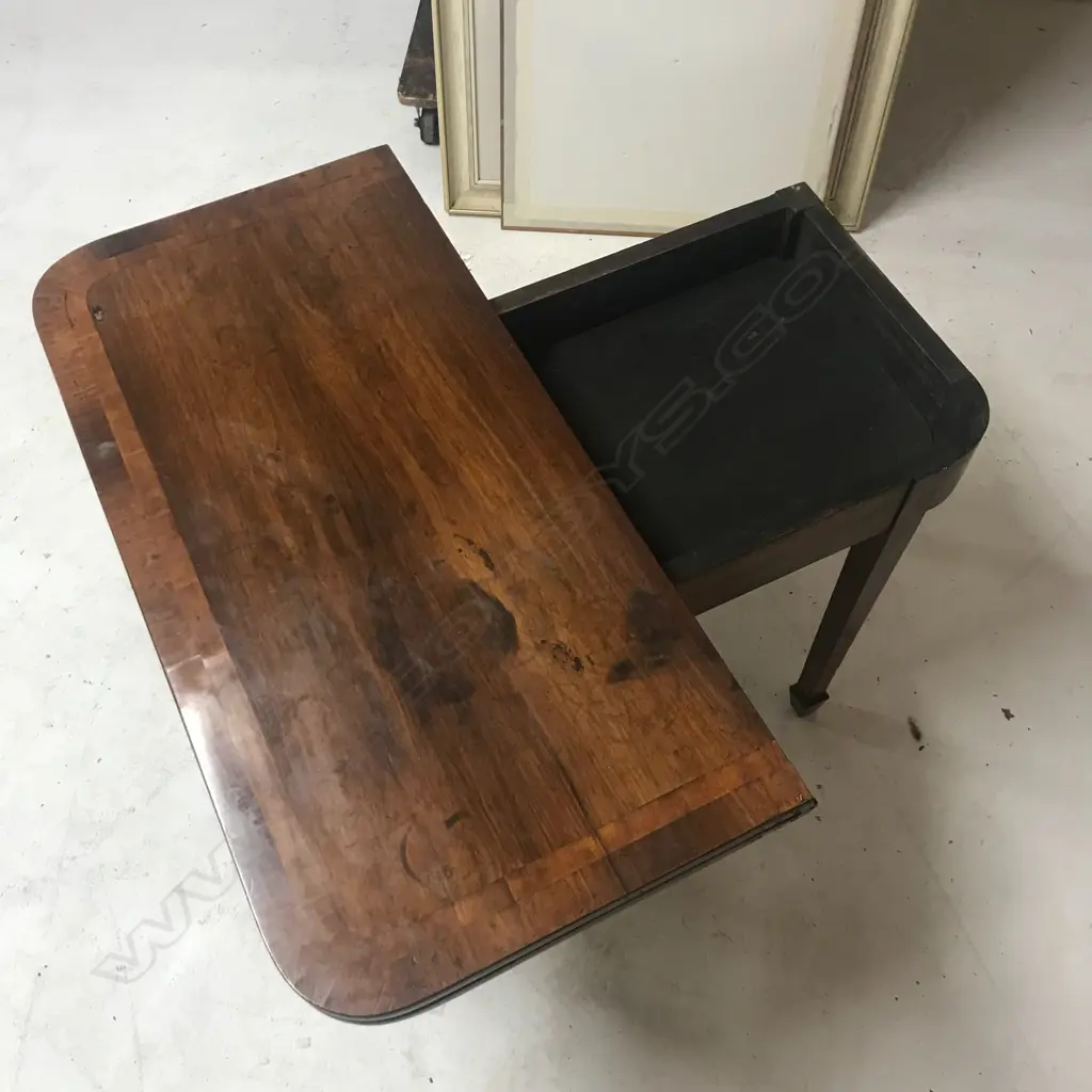 A George III mahogany fold-over top card table Image 1++