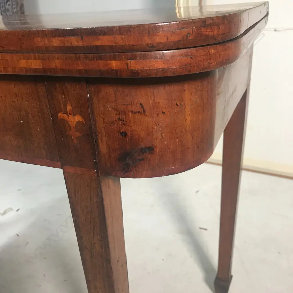 A George III mahogany fold-over top card table Image 1++