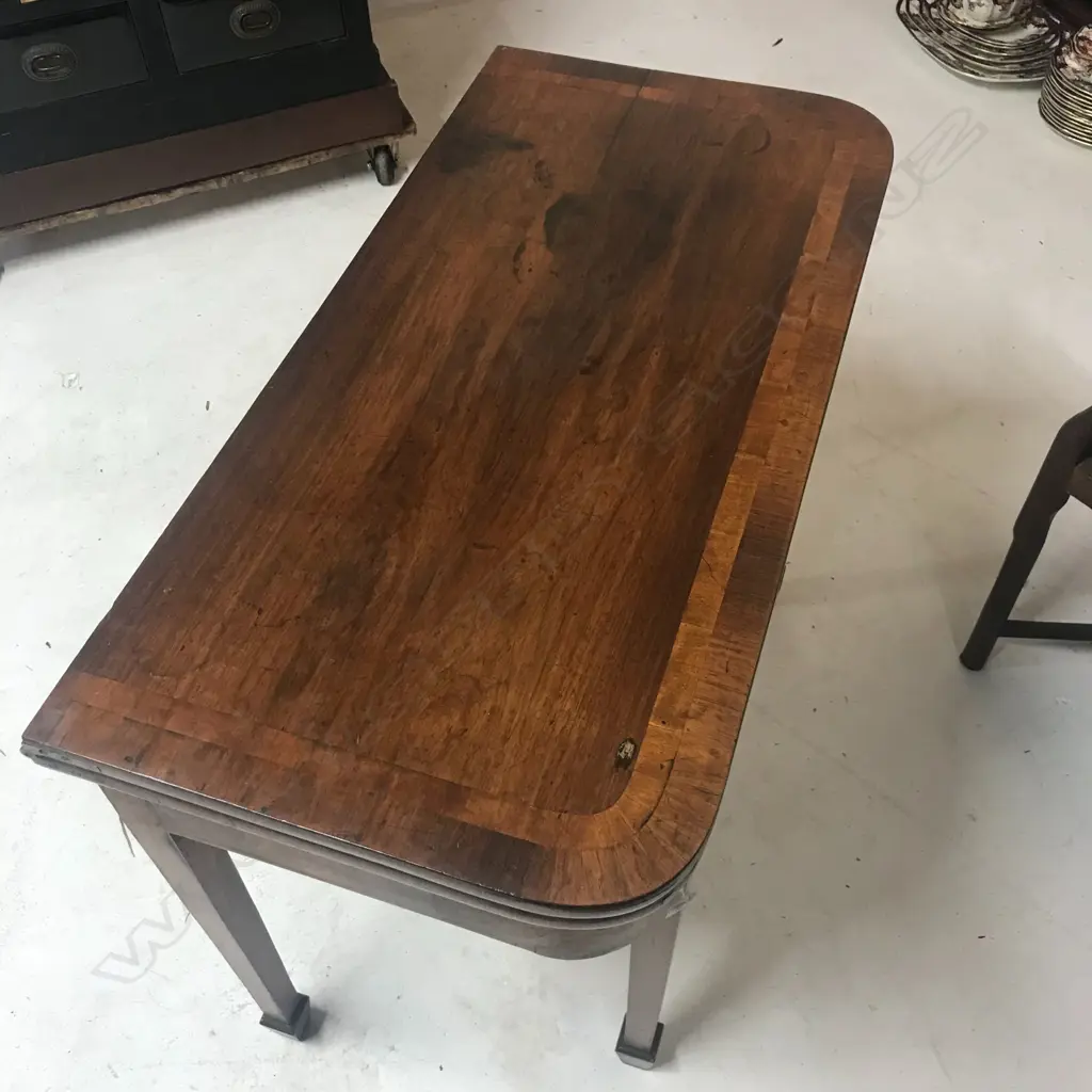 A George III mahogany fold-over top card table Image 1++