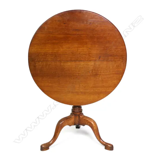 A Georgian oak tilt-top wine table