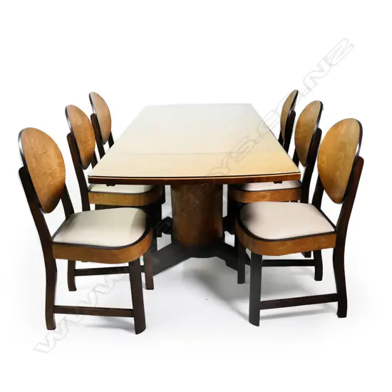 An Art Deco walnut and maple dining suite with six chairs
